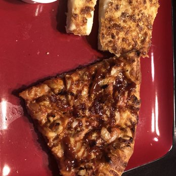 Marco's Pizza - two slices of pizza on a red plate - Pizza Near Me - Albany, Georgia