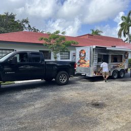 a man loading a food truck