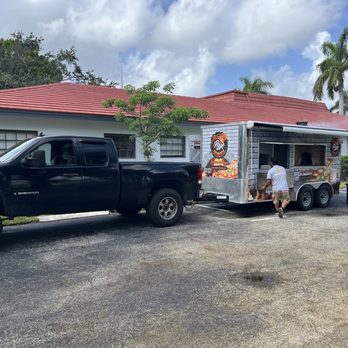 Best Pizza Heaven - a man loading a food truck - Food Trucks Near Me