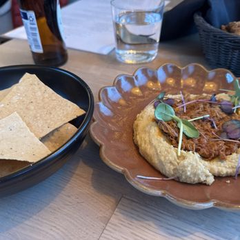 Ema - Hummus w/ Lamb Ragu and house made gluten free chips - Mediterranean Near Me - Glenview, Illinois Ema - Hummus w/ Lamb Ragu and house made gluten free chips - Mediterranean Near Me - Glenview, Illinois