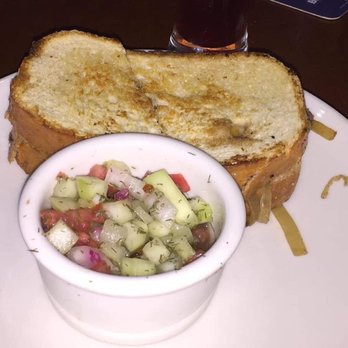 Half Wall - Pulled braised beef chuck short rib, beer braised onions, cheddar and provolone cheese on grilled sourdough with cucumber salad - American Near Me - New Smyrna Beach, Florida Half Wall - Pulled braised beef chuck short rib, beer braised onions, cheddar and provolone cheese on grilled sourdough with cucumber salad - American Near Me - New Smyrna Beach, Florida