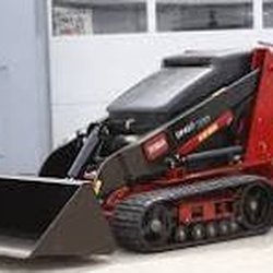Massachusetts Equipment Rental - Toro Dingo SX525 loader.  This was fantastic and saved my back from having to move all that loam by hand.