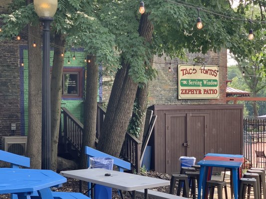 Photo of Zephyr Pub & Spirits - Kent, OH, US. Convenient ordering window for Taco Tantos hooked to the Zephyr patio