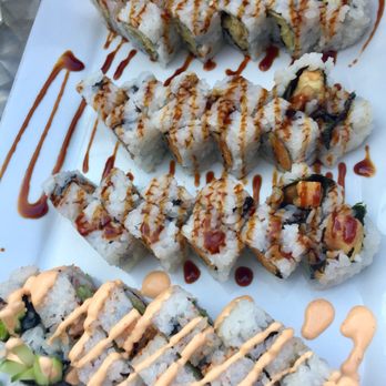 Formosa - Calamari roll on top, sweet potato rolls in the middle, and crab roll on bottom - Asian Fusion Near Me - Iowa City, Iowa Formosa - Calamari roll on top, sweet potato rolls in the middle, and crab roll on bottom - Asian Fusion Near Me - Iowa City, Iowa