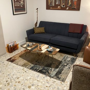 Flooring Innovations - a living room with a couch and a coffee table - Flooring Near Me - Palm Desert, California