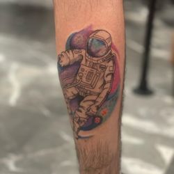 Eclipse Tattoos - Astronaut in galaxy on calf done by @anberlyntattoo