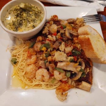 City Cafe - "The Cajun" Large grilled fish with Angel hair pasta topped with seafood. - Seafood Near Me - Baton Rouge, Louisiana City Cafe - "The Cajun" Large grilled fish with Angel hair pasta topped with seafood. - Seafood Near Me - Baton Rouge, Louisiana