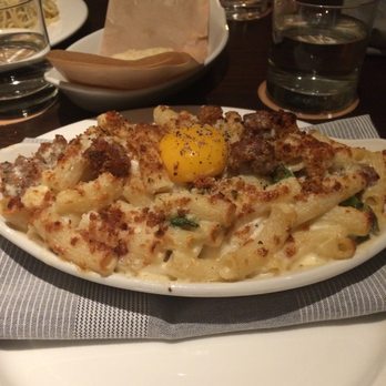 Stella Van Buren - Delicious carbonara with an egg yolk on top, ready for mixing! - Italian Near Me - Milwaukee, Wisconsin Stella Van Buren - Delicious carbonara with an egg yolk on top, ready for mixing! - Italian Near Me - Milwaukee, Wisconsin