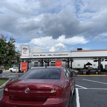 Truett's Grill - a red car in a parking lot - New American Near Me - McDonough, Georgia