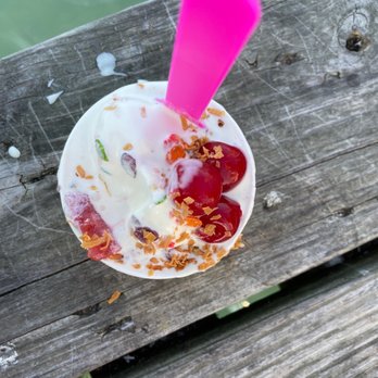 Emerson's By the Bay - a cup of ice cream with a pink spoon sticking out of it - Ice Cream & Frozen Yogurt Near Me - New Baltimore, Michigan Emerson's By the Bay - a cup of ice cream with a pink spoon sticking out of it - Ice Cream & Frozen Yogurt Near Me - New Baltimore, Michigan
