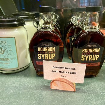 Tarnished Truth Distilling - Tarnished Truth Distilling Co. Gift Shop display of maple syrup and candles for purchase (prices as of Oct '21) - Distilleries Near Me - Virginia Beach, Virginia