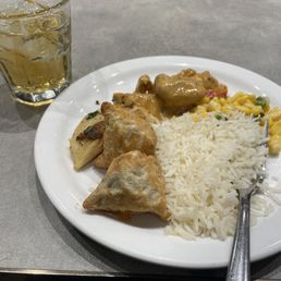 Samosas, peri peri chicken, perogi, rice & corn salad