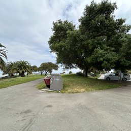 paved walkways along the beach (which is rocky!!! but it has a lot of shells), many trashcans, clean, lots of pretty trees and flowers