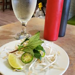 Hoang Gia Vietnamese Cuisine - Green bean sprouts, basil leaves, green hot pepper, and lime