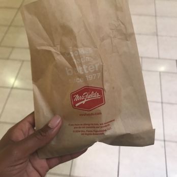 Mrs. Fields Sun Valley Mall - a hand holding a paper bag - Bakeries Near Me - Concord, California Mrs. Fields Sun Valley Mall - a hand holding a paper bag - Bakeries Near Me - Concord, California