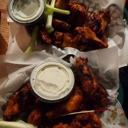 Brogen's South - Yummy hot (front) and teriyaki (back)  wings finished on the grill. Their blue cheese dressing is very good.