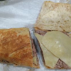 Bread not pressed or crispy and cheese not melted.