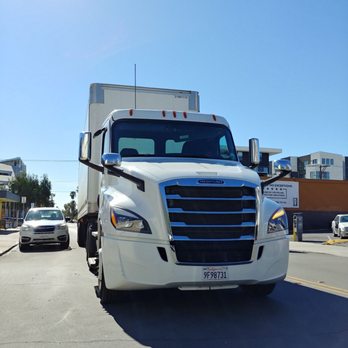 Crest Beverage - Crest truck parked on the middle of the street blocking traffic and an active driveway - Beverage Store Near Me - San Diego, California