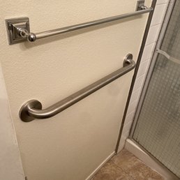 Grab bar installed low to assist with getting off toilet. Grab bar installed low to assist with getting off toilet.