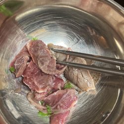 Raw beef from order in bowl