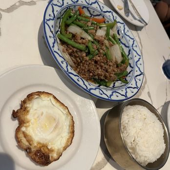 Charm Kitchen & Bar - E3. Basil Stir Fry (Pad Ka Prow). $2 for ground pork. $3 for egg - Thai Near Me - The Woodlands, Texas Charm Kitchen & Bar - E3. Basil Stir Fry (Pad Ka Prow). $2 for ground pork. $3 for egg - Thai Near Me - The Woodlands, Texas