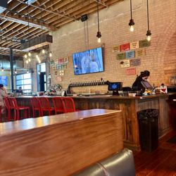 Prodigy Brewing - Bar area with drinks options on wall