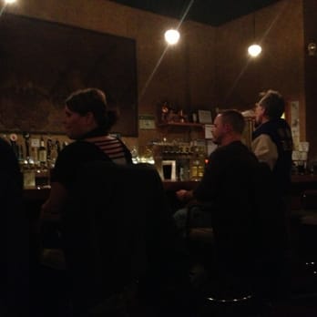Oasis Micro Pub - a group of people sitting at a bar - Pubs Near Me - Rockford, Illinois