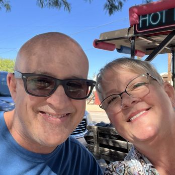 Katie's Cozy Cabins - Husband and I at Outlaws hog dog spot having a polish dog - Vacation Rentals Near Me - Tombstone, Arizona Katie's Cozy Cabins - Husband and I at Outlaws hog dog spot having a polish dog - Vacation Rentals Near Me - Tombstone, Arizona