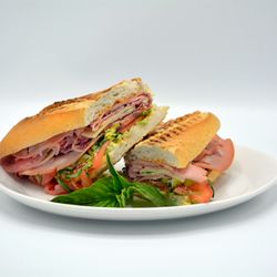 Ami Pizza? - Italian Hero: French Bread, Mortadella, Salami, Ham, Provolone, Parmesan, Basil, Tomatoes,
Lettuce, Pepperoncini Peppers & Vinaigrette