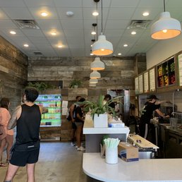 The employees trying their best to fulfill 15 orders at once on a Saturday at noon. The employees trying their best to fulfill 15 orders at once on a Saturday at noon.