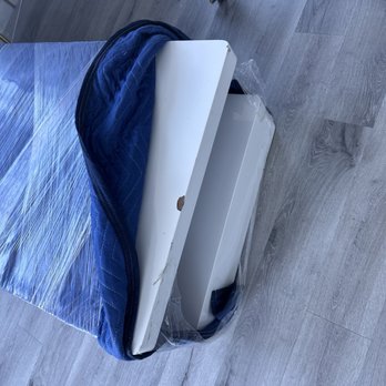 Two Men and a Truck Moving and Storage - Coffee table chipped multiple places - Movers Near Me Two Men and a Truck Moving and Storage - Coffee table chipped multiple places - Movers Near Me