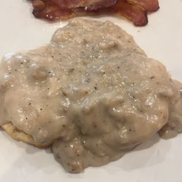 Biscuits and gravy with a side of bacon