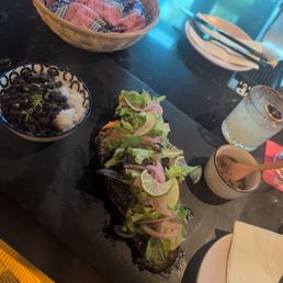Grilled Red Snapper Adobo, black beans and white rice, mild salsa, warm corn tortillas and a classic margarita with Tajin rim