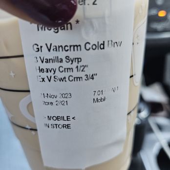 Starbucks - a hand holding a cup of coffee - Coffee & Tea Near Me - San Diego, California