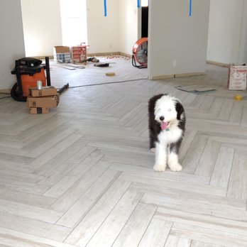 Young Tile International - Ignore the puppy and check out those gorgeous floors! - Flooring Near Me