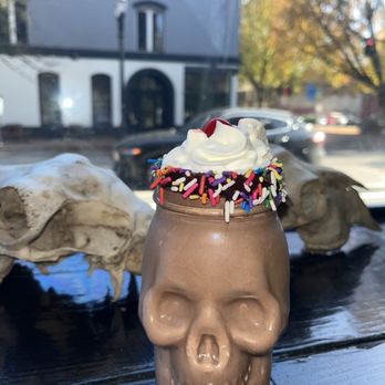 Black Cat Frozen Custard - Chocolate custard shake in a Halloween skull glass - Coffee & Tea Near Me - Portland, Oregon Black Cat Frozen Custard - Chocolate custard shake in a Halloween skull glass - Coffee & Tea Near Me - Portland, Oregon