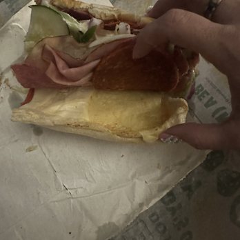 Subway - a person holding a sandwich in their hand - Sandwiches Near Me - Baltimore, Maryland