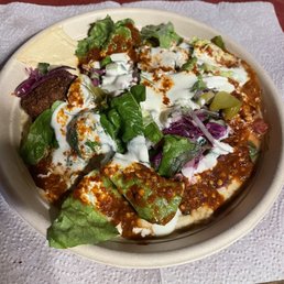 Chicken shawarma bowl with all toppings with creamy garlic and red sauce.