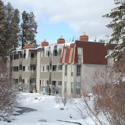 Stay Winter Park - The winter exterior of a condo building