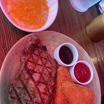 Eola Lounge - Steak and eggs meal. The hash brown and bacon are included. Side of cheese grits - Tapas/Small Plates Near Me - Orlando, Florida Eola Lounge - Steak and eggs meal. The hash brown and bacon are included. Side of cheese grits - Tapas/Small Plates Near Me - Orlando, Florida