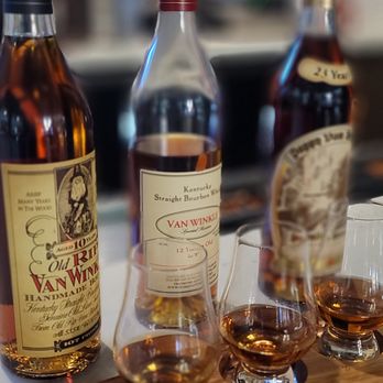 Mash + Oak - a variety of whiskeys on a cutting board - New American Near Me - Covington, Kentucky