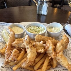 The CattleBaron Steakhouse & Bar - Lunch special. Red snapper chips and fries with tartar sauce, coleslaw and mayo for the fries.
