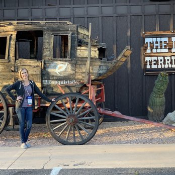 Last Territory Steakhouse - a woman standing next to a wagon - Steakhouses Near Me - Tucson, Arizona Last Territory Steakhouse - a woman standing next to a wagon - Steakhouses Near Me - Tucson, Arizona