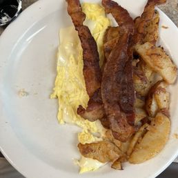 Sunny side: two eggs with cheese added Breakfast meat and home fries and two pancakes swapped the bread for a side biscuit Sunny side: two eggs with cheese added Breakfast meat and home fries and two pancakes swapped the bread for a side biscuit