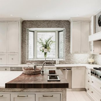 Ciot - a kitchen with white cabinets and a marble island - Flooring Near Me - Montreal, Quebec Ciot - a kitchen with white cabinets and a marble island - Flooring Near Me - Montreal, Quebec