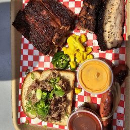 platter with pulled pork, ribs and brisket
