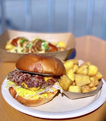 Photo of Wursthall - San Mateo, CA, United States. COVID-19 PATIO DINING: Smashed Cheeseburger w/ onion, lettuce, pickles, garlic mayo, brioche bun, fried potatoes | $17