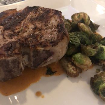 Copper Fox Gastropub - Pork Porterhouse - crispy brussles and chorizo cream. - New American Near Me - Chicago, Illinois