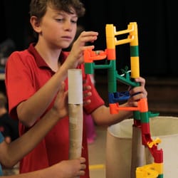 Science of Fun - STEM Camps - Roller coaster fun- note the toilet paper tubes on the left that the kids used to expand the roller coaster. Awesome!