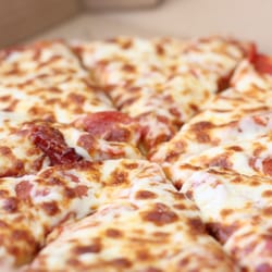 Main Street Pizza - We hand-toss each and every pizza! Although our typical crust is a medium thickness, we can toss you up a thin or thick crust as well!